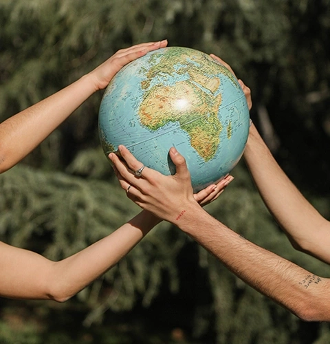 Hands holding globe. Concept of saving the world and environmental protection.