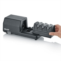 Black electric knife sharpener with four sharpening modules, hand holding