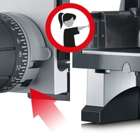 Warning sign with a woman reaching her hand towards the device.