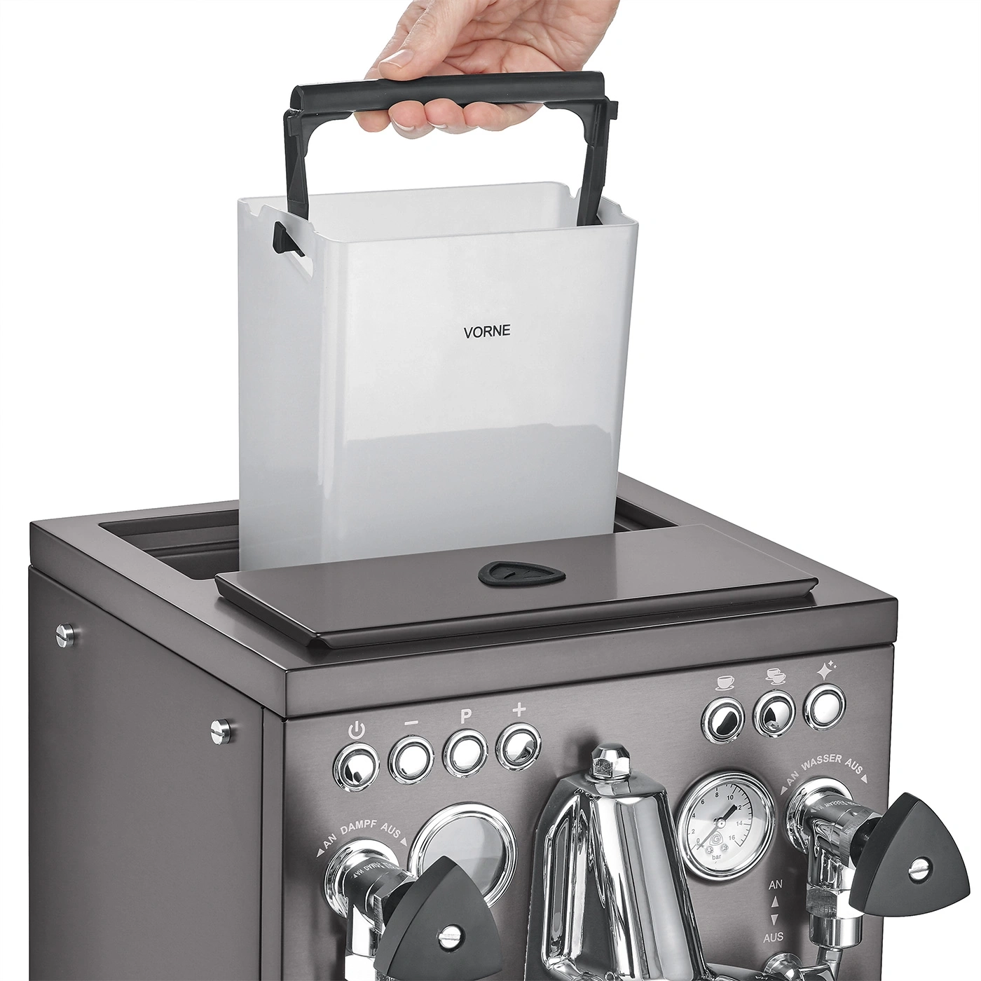 Person lifting water tank from coffee machine, close-up shot, handle visible.