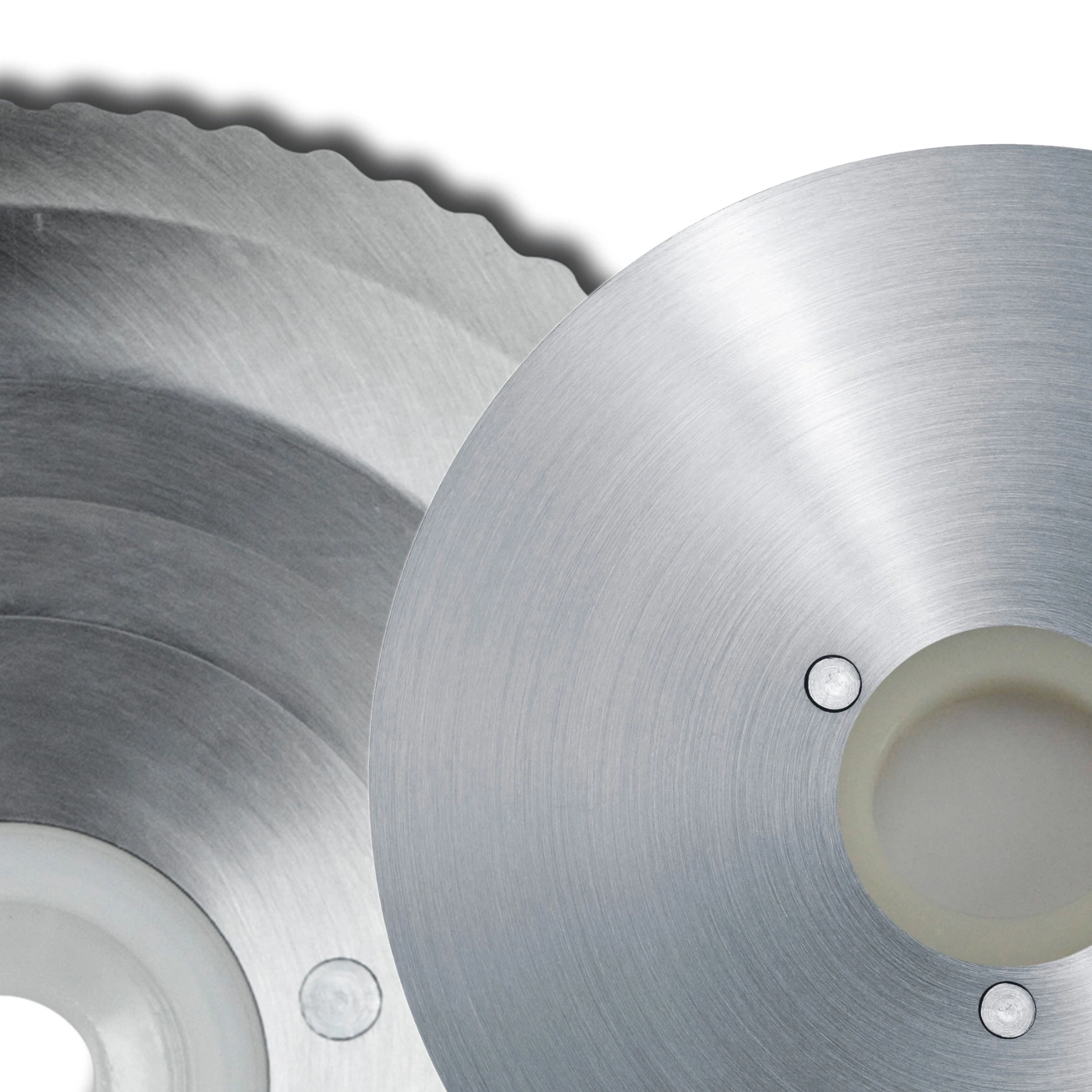 Close-up of metal circular saw blades, sharp teeth, shiny surface, industrial tools