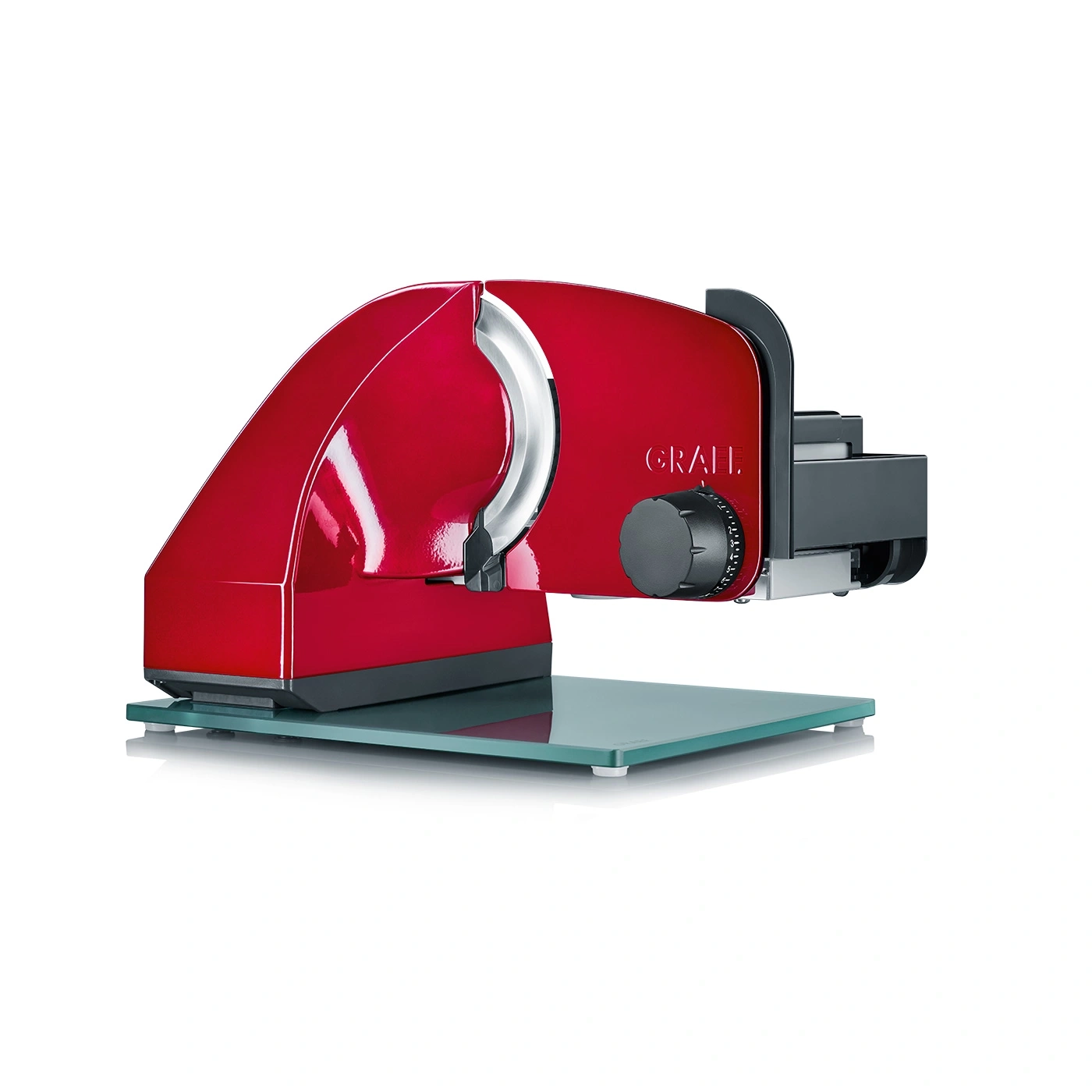 Red food slicer on glass base, kitchen appliance, food preparation, cutting