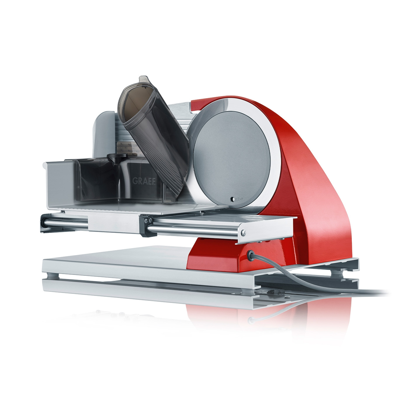 Red electric food slicer with gray blade and tray, perfect for slicing.