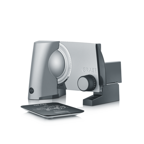 Silver Graef food slicer with digital scale on a white reflective surface