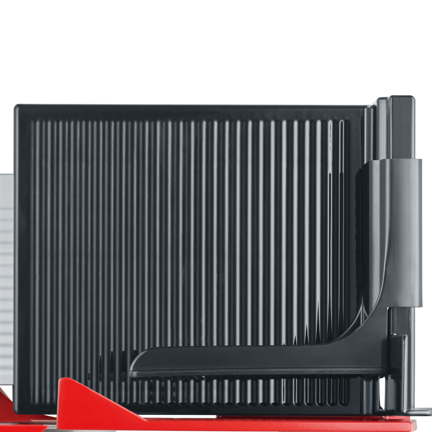 Close-up of a black cutting aid with red elements